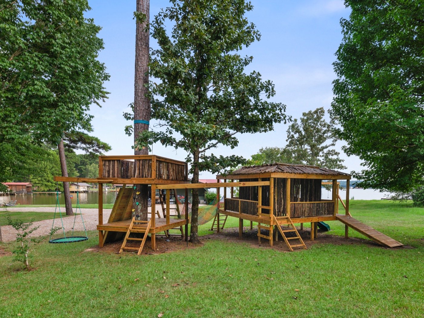 Custom wooden playset overlooking the lake
